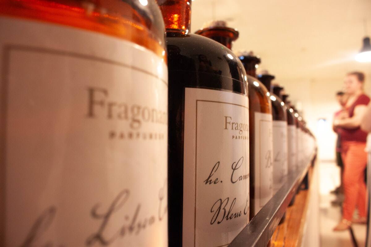 Neatly faced bottles on a retail display shelf