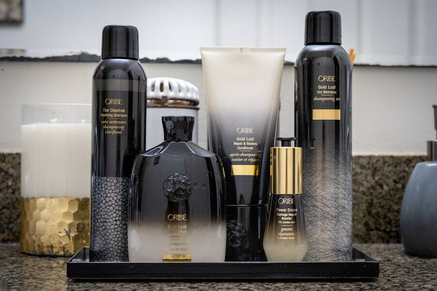 Dark professional treatment bottles standing on a salon counter