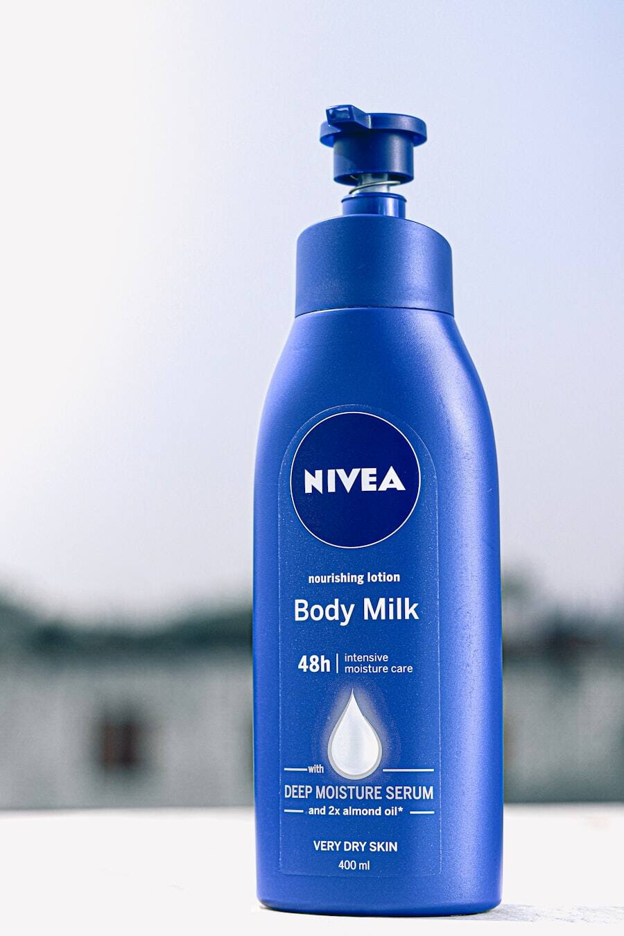 Body lotion bottle photographed against a plain background