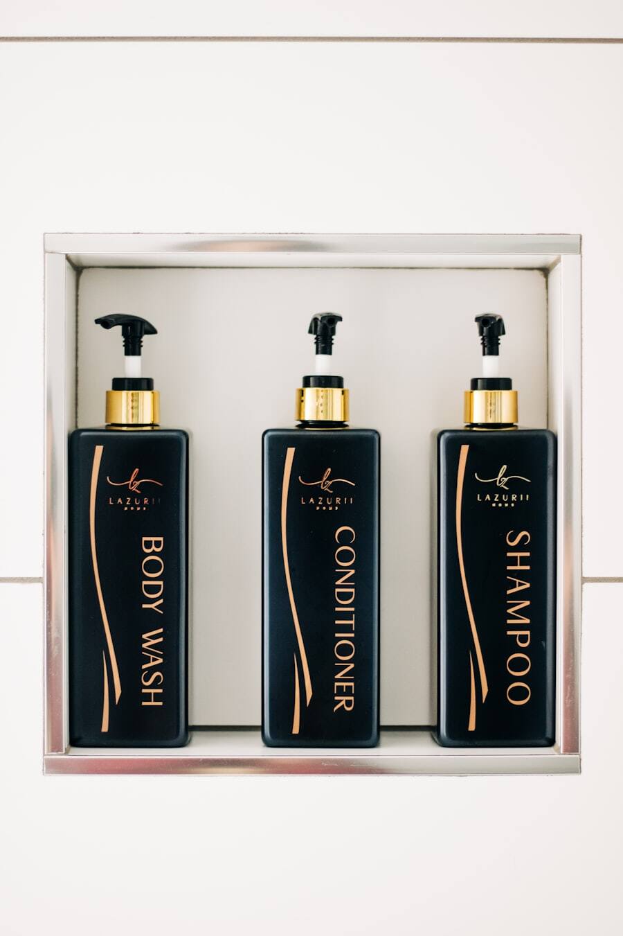 Professional shampoo and conditioner bottles on a shelf